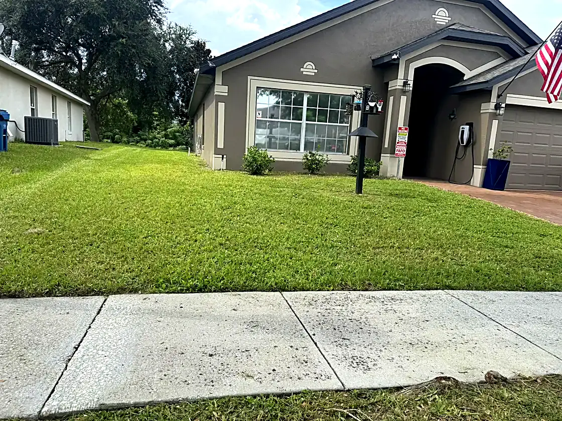 Front lawn cut and edged to the sidewalk